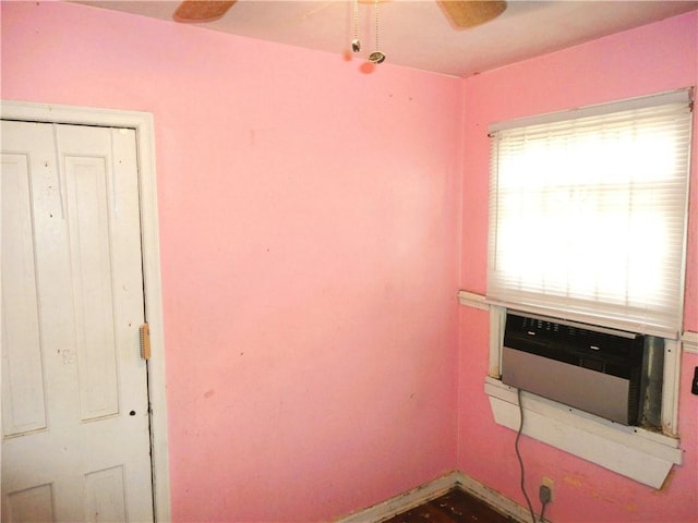 interior space featuring ceiling fan and cooling unit