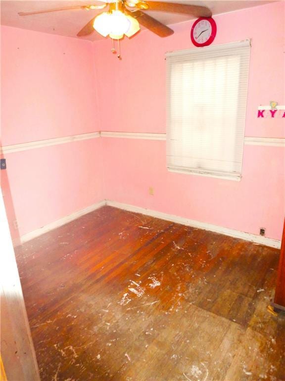 spare room with hardwood / wood-style flooring and ceiling fan