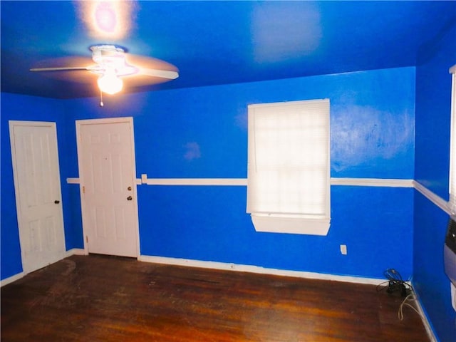 unfurnished room with hardwood / wood-style flooring and ceiling fan