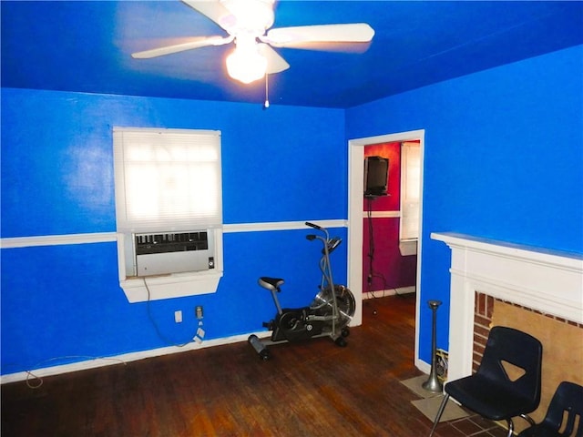 workout room featuring ceiling fan, cooling unit, and wood-type flooring