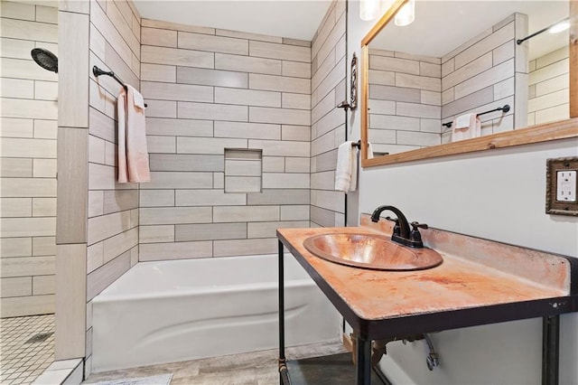 full bath with a tub, walk in shower, and a sink