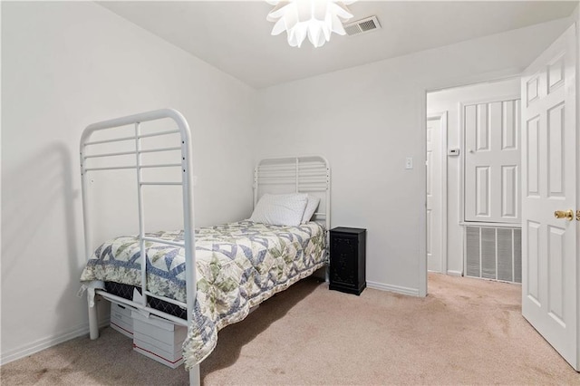 bedroom with light carpet, baseboards, and visible vents