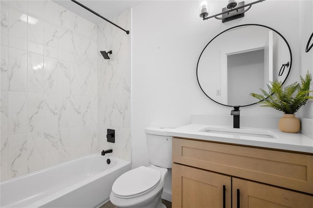 full bathroom with vanity, toilet, and tiled shower / bath