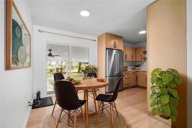 dining room featuring ceiling fan and light hardwood / wood-style floors