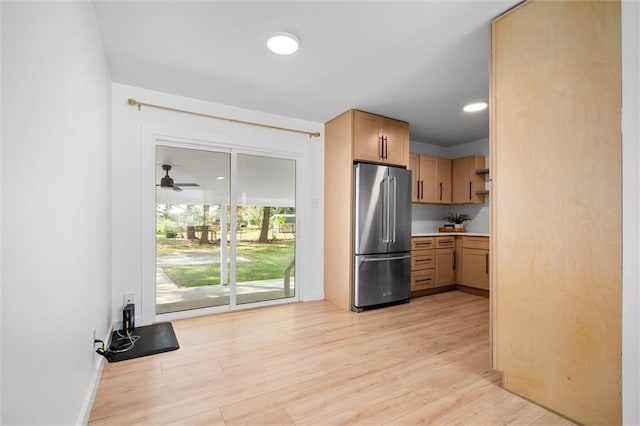 kitchen featuring ceiling fan, light hardwood / wood-style floors, and high end refrigerator