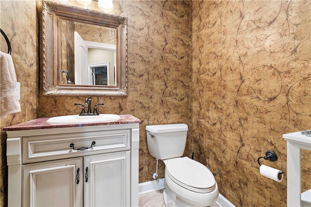 bathroom featuring oversized vanity, toilet, and tile flooring