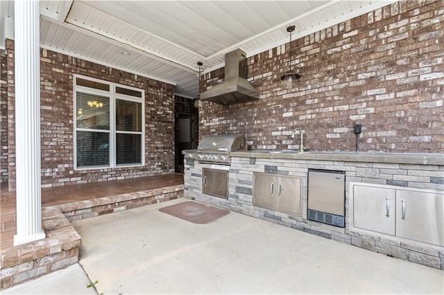 view of terrace featuring exterior kitchen, sink, and grilling area