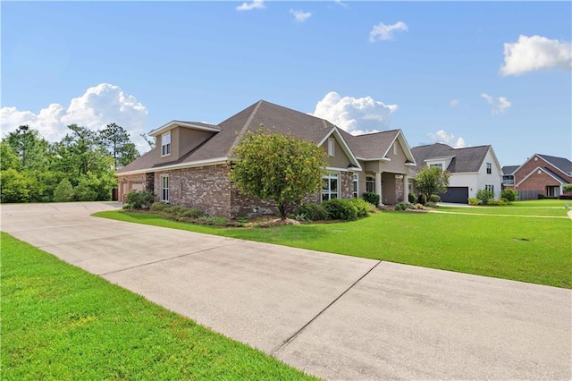 view of front of property with a front yard and a garage