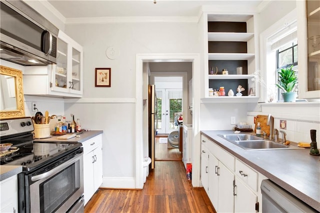 kitchen featuring white cabinetry, sink, dark wood-type flooring, appliances with stainless steel finishes, and ornamental molding