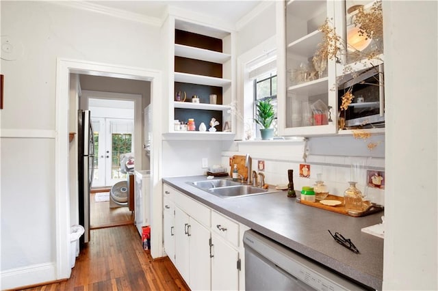 kitchen featuring appliances with stainless steel finishes, tasteful backsplash, sink, dark hardwood / wood-style floors, and white cabinetry