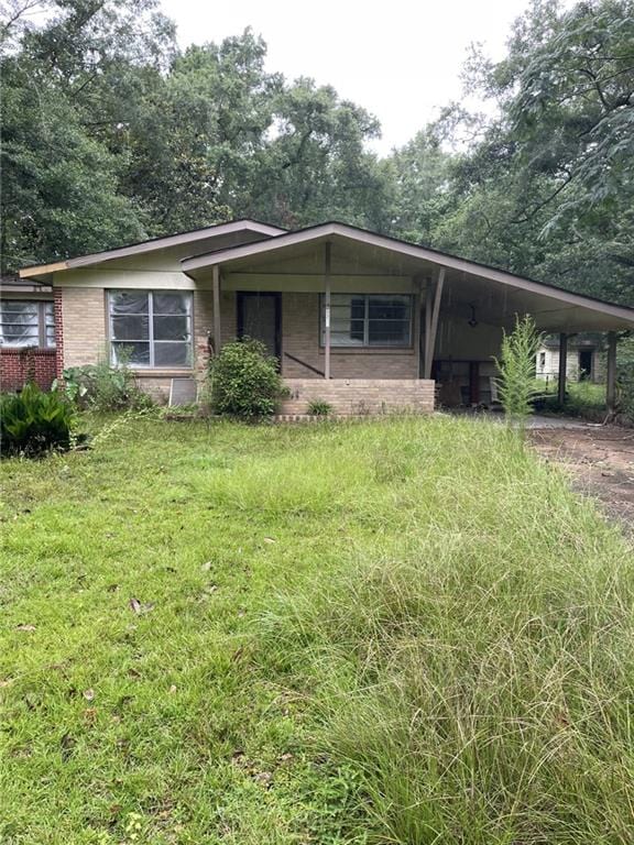 view of front of home with a carport