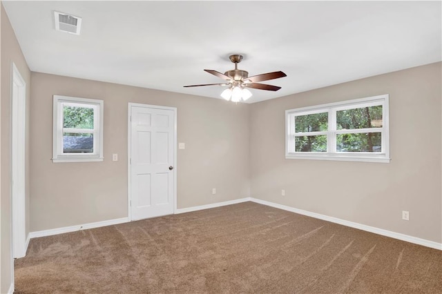 113 Hilltop Dr E, Mobile, AL 36608 - empty room with plenty of natural light, baseboards, and carpet floors