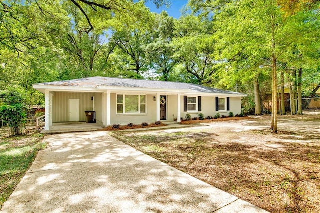 113 Hilltop Dr E, Mobile, AL 36608 - single story home with driveway, a carport, fence, and view of wooded area
