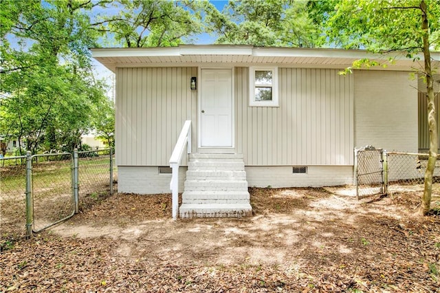 113 Hilltop Dr E, Mobile, AL 36608 - doorway to property featuring crawl space, fence, and a gate