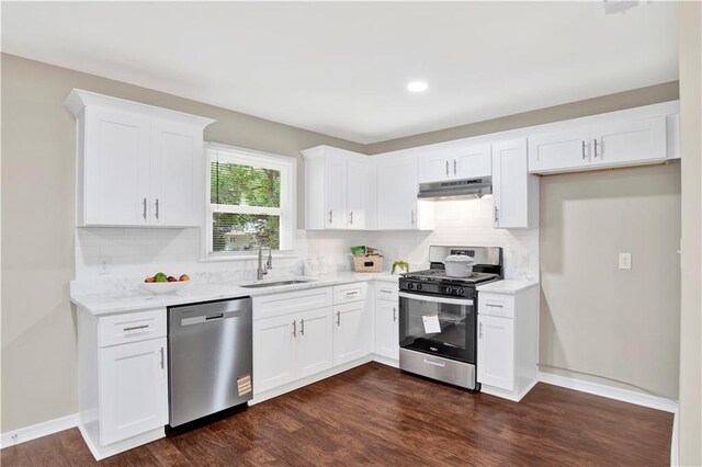 113 Hilltop Dr E, Mobile, AL 36608 - kitchen with stainless steel appliances, a sink, under cabinet range hood, decorative backsplash, and recessed lighting