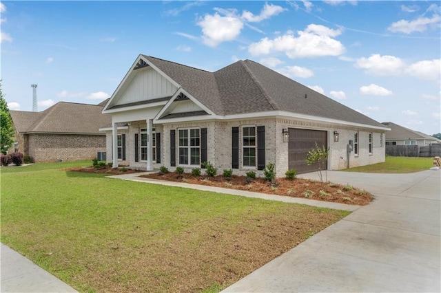 craftsman inspired home with central AC, brick siding, a garage, a front yard, and driveway