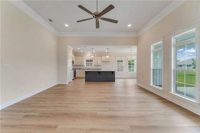 unfurnished living room with crown molding, a ceiling fan, light wood-style floors, and visible vents