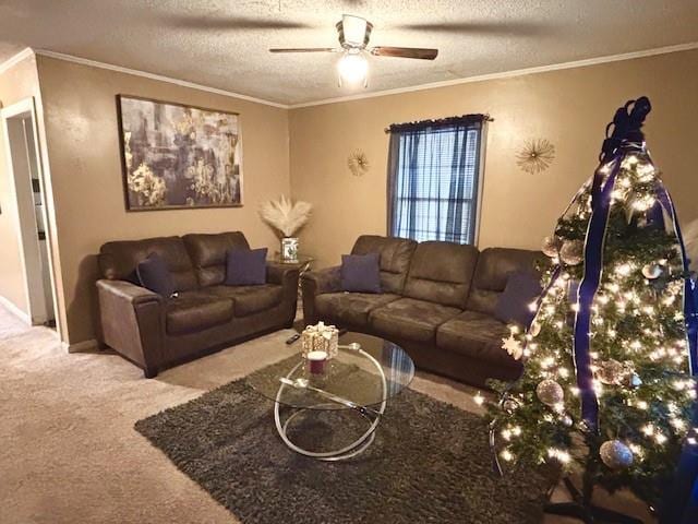 carpeted living room featuring a textured ceiling, ceiling fan, and ornamental molding