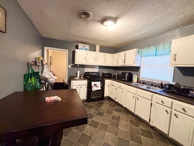 kitchen featuring sink, white cabinets, a textured ceiling, and black range with electric cooktop