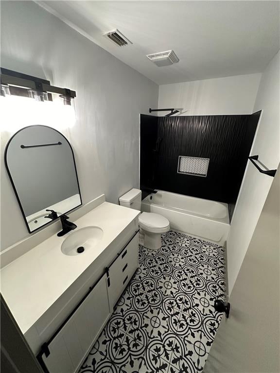 full bathroom with vanity, toilet, tile patterned flooring, and shower / washtub combination