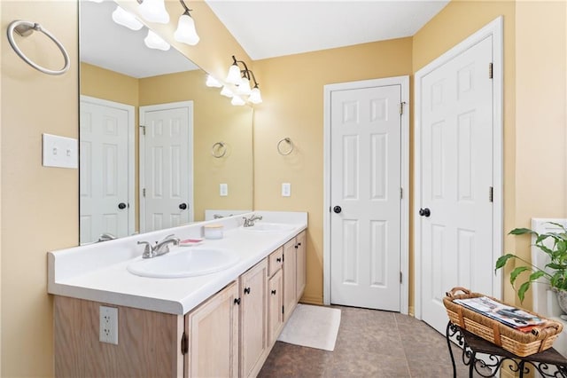 bathroom featuring tile patterned flooring and vanity