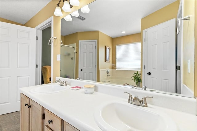 bathroom with vanity, tile patterned floors, and separate shower and tub