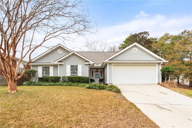 ranch-style house featuring a garage and a front yard