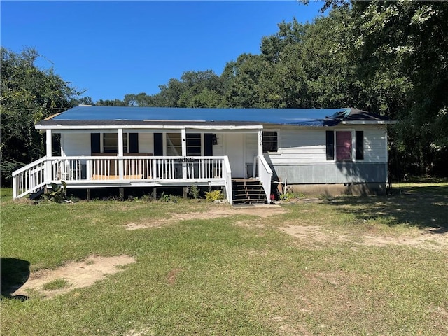 manufactured / mobile home with a porch and a front lawn