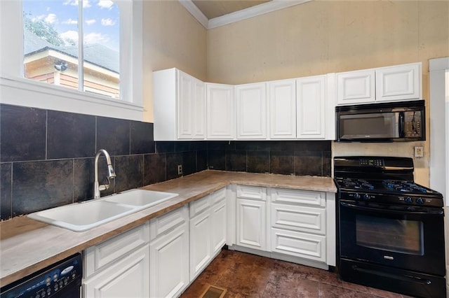 kitchen featuring sink, crown molding, tasteful backsplash, black appliances, and white cabinets