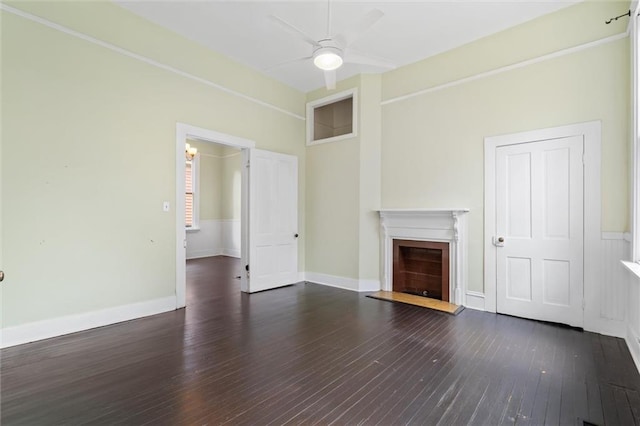 unfurnished living room with dark wood-type flooring and ceiling fan