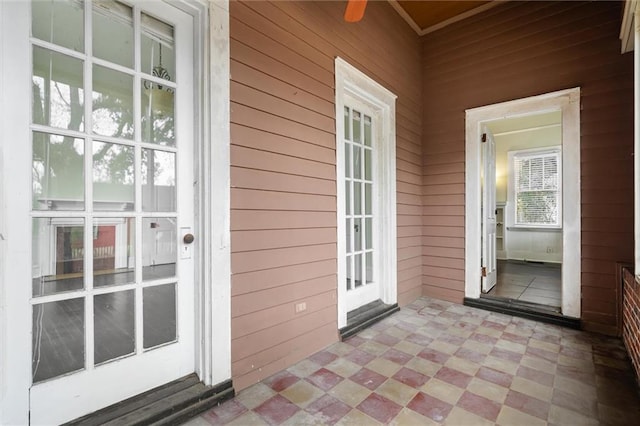 exterior space featuring ceiling fan