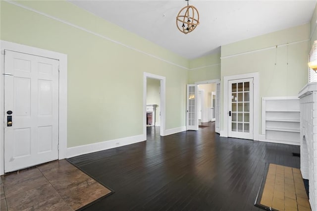 living room with a fireplace and dark hardwood / wood-style floors