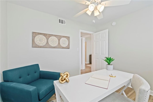 office area with ceiling fan and wood-type flooring