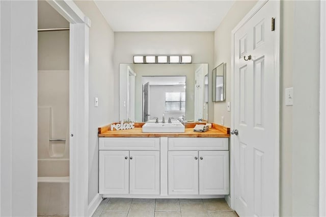 bathroom featuring tile patterned floors and vanity