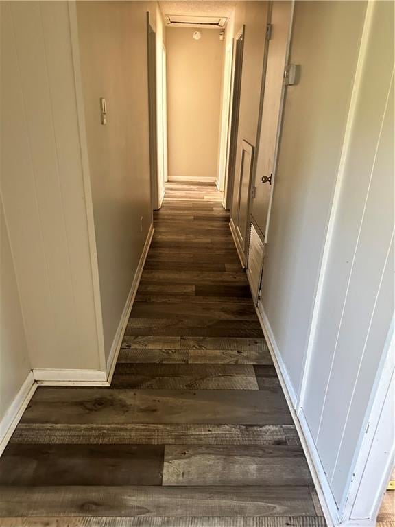 hallway featuring dark hardwood / wood-style floors