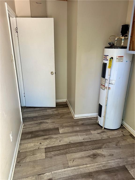 utility room featuring electric water heater