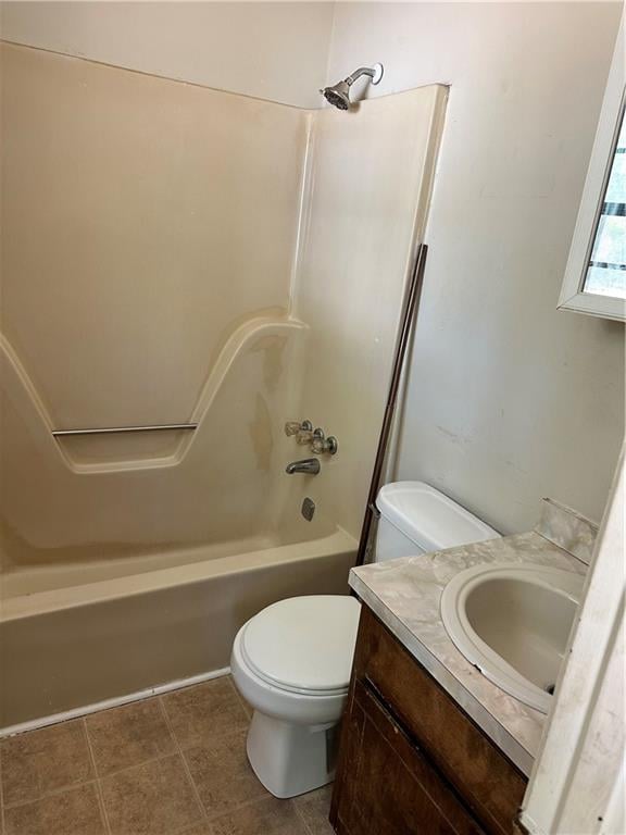 full bathroom with shower / bathtub combination, toilet, tile flooring, and vanity