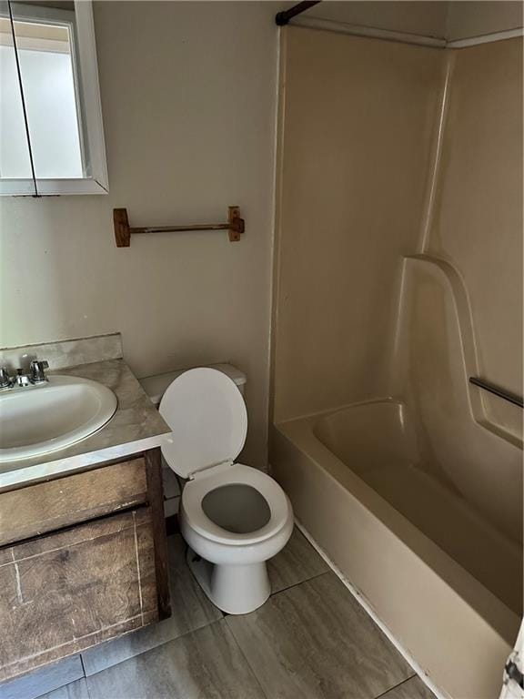 full bathroom featuring toilet, bathtub / shower combination, tile flooring, and oversized vanity