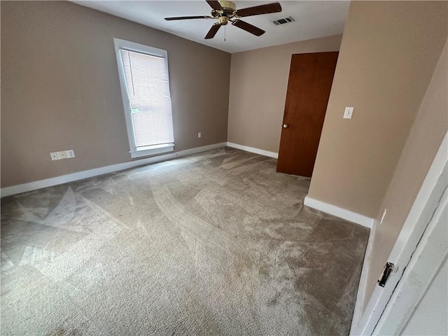 carpeted empty room with ceiling fan