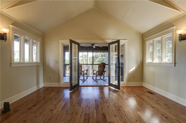 interior space with hardwood / wood-style floors, french doors, a healthy amount of sunlight, and wood ceiling