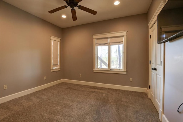 unfurnished room featuring carpet and ceiling fan