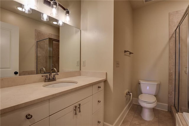 bathroom featuring tile patterned floors, vanity, toilet, and walk in shower