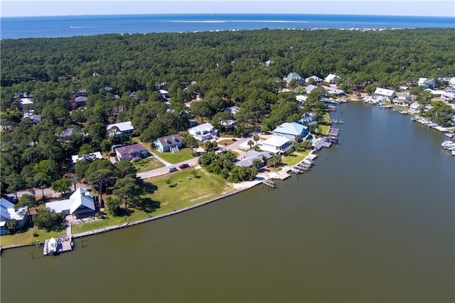 bird's eye view with a water view, a forest view, and a residential view