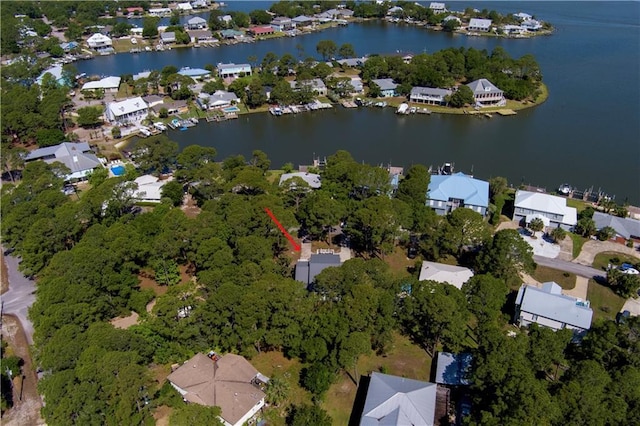 birds eye view of property featuring a water view and a residential view