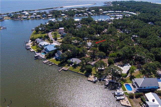 drone / aerial view featuring a water view and a residential view