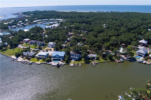 drone / aerial view featuring a water view and a residential view