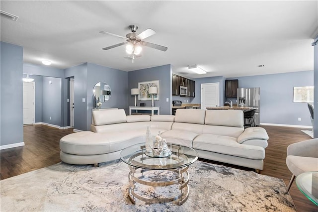1951 Stonepine Dr, Semmes, AL 36575 - living area featuring dark wood-type flooring and ceiling fan