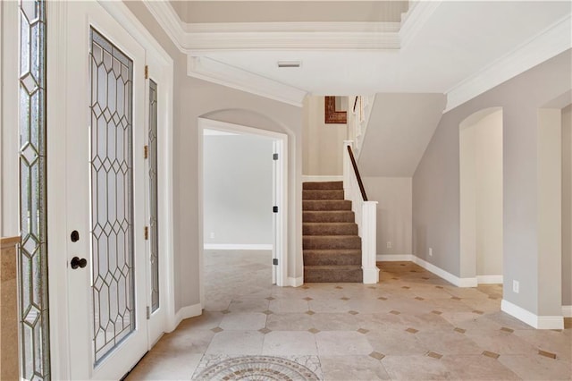 foyer featuring ornamental molding