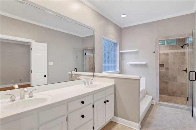 bathroom with a wealth of natural light, tile patterned floors, vanity, a shower with shower door, and ornamental molding