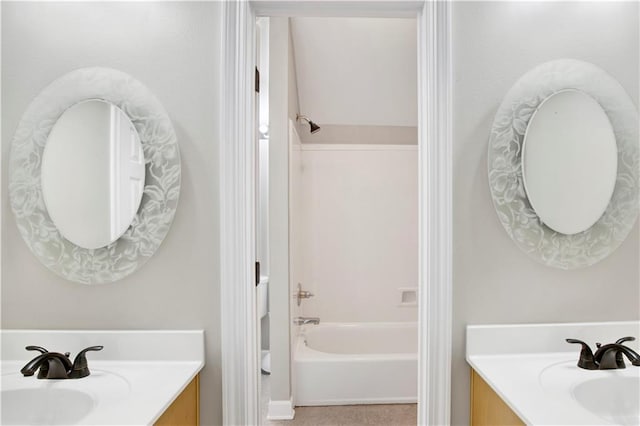 bathroom featuring tile patterned flooring, vanity, and tub / shower combination